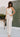 eliana oatmeal and black striped pants and peplum tank - front view