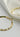 Top view of Julissa Gold Hammered Hoop Earrings