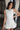 London White Ruffle Hem Romper- close up top view