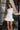 London White Ruffle Hem Romper- front top view