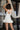 London White Ruffle Hem Romper- back view