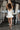 London White Ruffle Hem Romper- full body back view