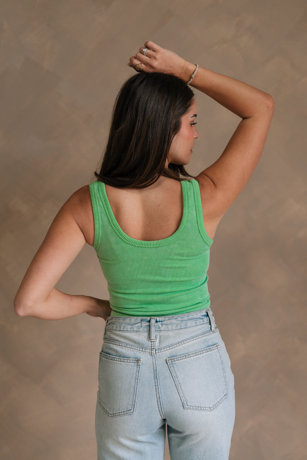 Back view of female model wearing the Kendall Ribbed Longline Brami in Green which features Ribbed Fabric, Washed Details, Longline Waist, Round Neckline, Thick Straps and Sleeveless.