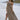 Full body frontal side view of female model wearing the Harper Brown & White Halter Maxi Dress which features Brown and White Geometric Pattern, Maxi Length, Halter Neckline with Tie Closure, Upper Ruched Detail and Open Back