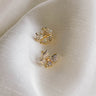 Up close view of both Blaire Bow Stud Earrings features mini gold bow shaped studs.