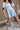 Gemma Light Blue Short Sleeve Romper - lower body front view
