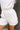 Macie Soft White Romper- close up side bottom view