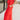 Side view of model wearing the Vada Red Wide Leg Pants that feature red woven fabric, side pockets, an elastic waistband, and flowy wide legs.