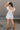 Amalie White & Blue Floral Bubble Romper- full body back view