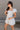Amalie White & Blue Floral Bubble Romper- full body side view