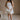 Full body view of female model wearing the Kate Off White Floral Strapless Mini Dress which features White Floral Print, Tiered Body, Mini Length, White Lining Sweetheart Neckline, Strapless and Back Zipper with Hook Closure.