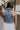 Back view of female model wearing the Dallas Denim Ruched Tank Medium Denim Lightweight Fabric, Front Ruched Detail, Scoop Neckline, Collared Neckline and Sleeveless