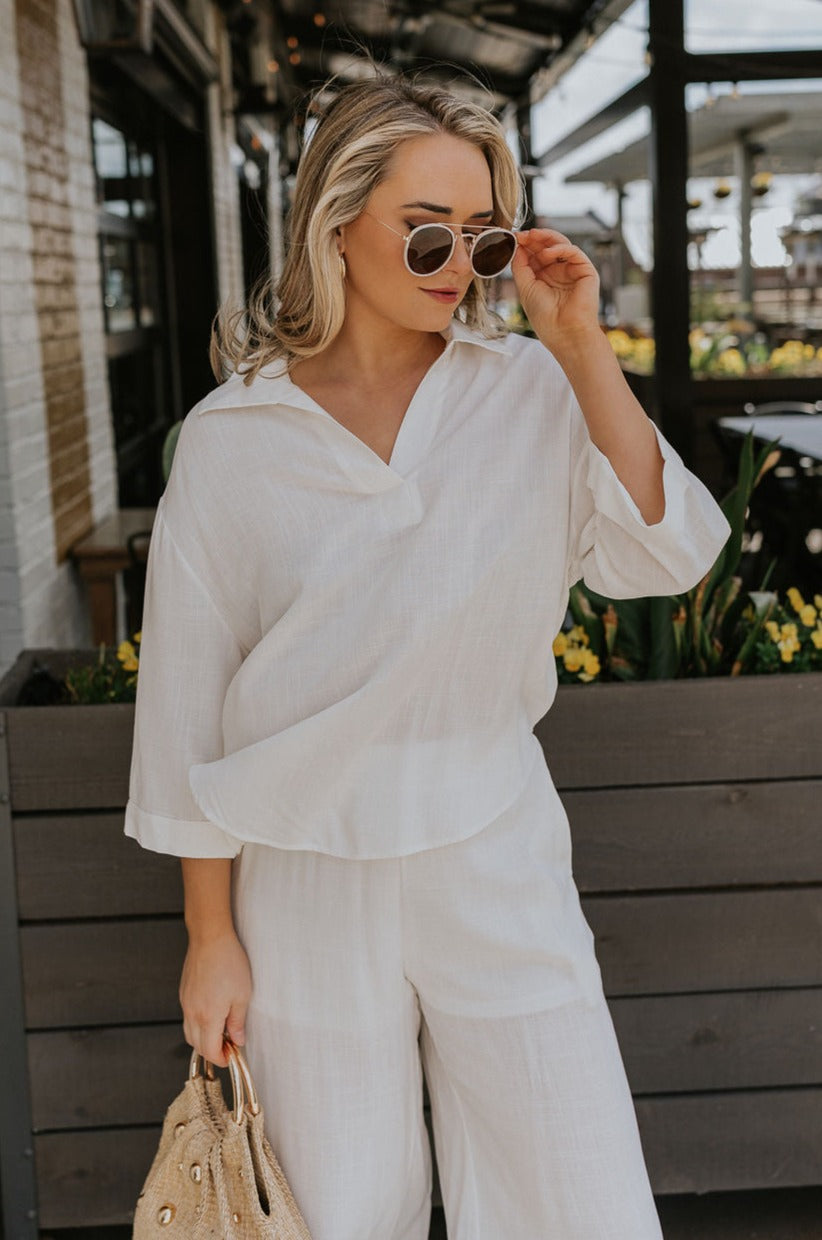Front view of female model wearing the Rebecca Ivory Linen Top which features vory Linen Fabric, Half Sleeves   and Collared Neckline with V-Cutout