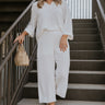 Full body view of female model wearing the Rebecca Ivory Linen Cropped Pants which features  Ivory Linen Fabric, Cropped Pant Legs, Ivory Lining, Two Side Pockets and Elastic Waistband