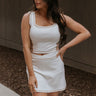 Front view of female model wearing the Hayden Cream & Mocha Tank which features Stretchy White Fabric, Taupe Side Colorblocking, Taupe Contrast Stitching, Square Neckline, Thick Straps and Cropped Waist