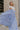 Full body view of female model wearing the Alana Periwinkle Tiered Maxi Skirt which features Periwinkle Lightweight Fabric, Maxi Length, Periwinkle Thigh Length Lining, Tiered Body and Elastic Waistband with Drawstring Ties