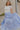 Full body view of female model wearing the Alana Periwinkle Tiered Maxi Skirt which features Periwinkle Lightweight Fabric, Maxi Length, Periwinkle Thigh Length Lining, Tiered Body and Elastic Waistband with Drawstring Ties