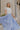 Full body view of female model wearing the Alana Periwinkle Tiered Maxi Skirt  which features Periwinkle Lightweight Fabric, Maxi Length, Periwinkle Thigh Length Lining, Tiered Body and Elastic Waistband with Drawstring Ties