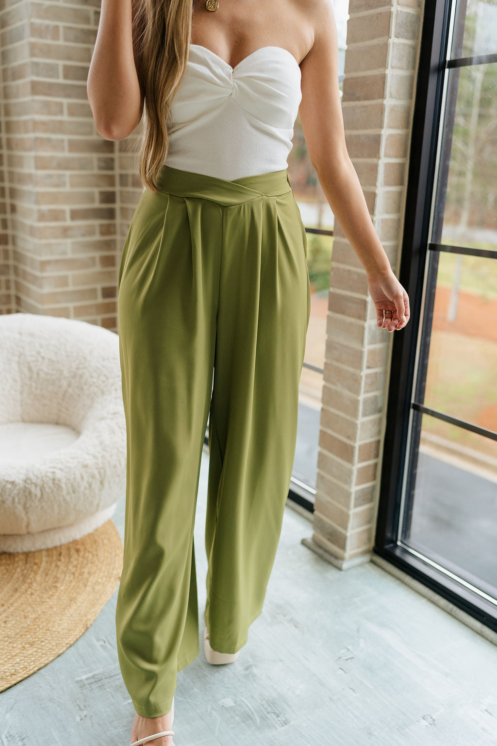 Front view of female model wearing the Rowan Olive Wide Leg Pants which features Olive Green Lightweight Fabric, Wide Pant Leg and Elastic V- Waistband