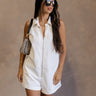 Front view of female model wearing the Serena Zip-Up Sleeveless Romper in White which features Cotton Fabric, Two Front Pockets, Two Back Pockets, Front Zip-Up Closure, Collared Neckline and Sleeveless.