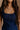 Close up view of female model wearing the Stella Dark Denim Wash Sleeveless Mini Dress which features features Dark Denim Wash Fabric, Front Zip-Up Closure, Square Neckline and Sleeveless.