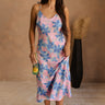 Full body view of female model wearing the Madison Blue and Rose Pink Midi Dress which features Blue and Pink Floral Design, Midi Length,  Sweetheart Neckline and Adjustable Straps.