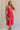 Full body view of female model wearing the Nova Smocked Tiered Midi Dress which features Lightweight Fabric, Fully Lined, Tiered Ruffle Body, Smocked Upper, Square Neckline and Elastic Straps.