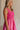 Close up side view of female model wearing the Cecilia Pink Smocked Midi Dress which features Pink Lightweight Fabric, Pink Lining, Pockets On Each Side, Midi Length, Textured Upper, Square Neckline and Sleeveless