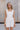 Madilyn White Back Bow Romper- front view