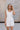 Madilyn White Back Bow Romper- top front view