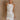 Front view of female model wearing the Isla White Silver Ruched Halter Neckline Mini Dress which features White Silver Fabric, White Lining, Ruched Details, Overlap Hem, Halter Neckline and Monochrome Back Zipper with Hook Closure