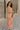 Full body side view of female model wearing the Lyla Peach Satin Midi Dress which features Peach Satin Fabric, Maxi Length, Strapless Design, Back Cut-Out Design and Monochrome Side Zipper with Hook Closure