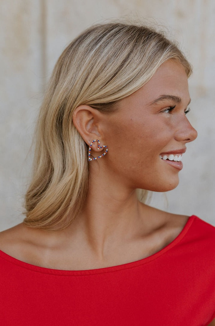 Side view of a model wearing the Danika Heart Earrings.