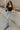 Full body view of female model wearing the Andrea Black Square Neckline Sleeveless Bodysuit which features Black Lightweight Fabric, Square Neckline, Sleeveless and Thong Bottom with Button Snap Closure