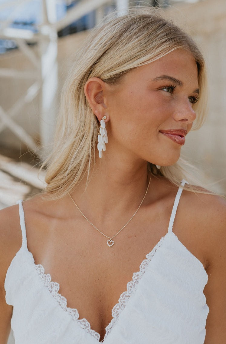 Side view of model shown wearing the Chloe Necklace.