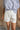 Phoebe White Pleated Shorts- top view