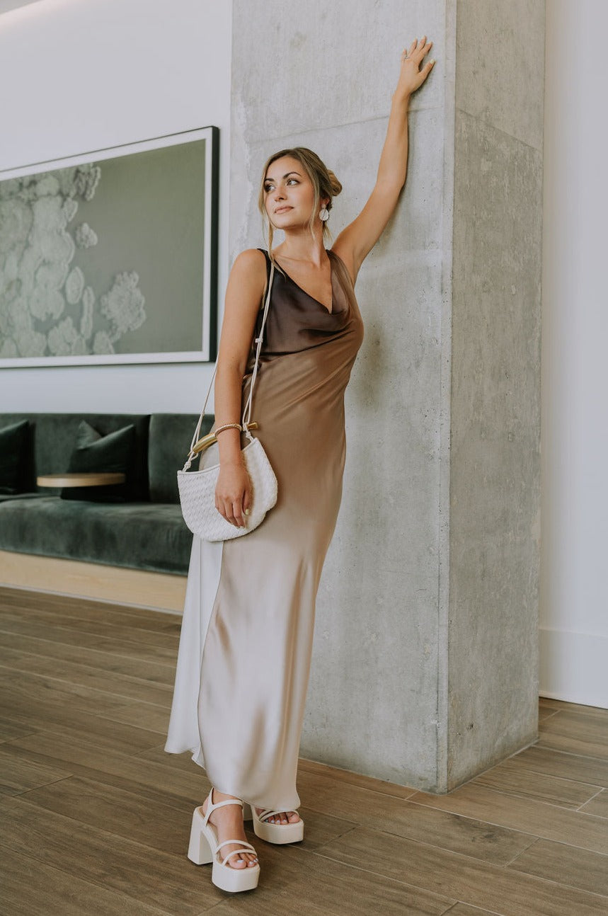 Full body view of female model wearing the Franceska Taupe Ombre Satin Midi Dress which features Brown Ombre Satin Fabric, Midi Length, Sleeveless, Black Thigh Length Lining and Cowl Neckline 
