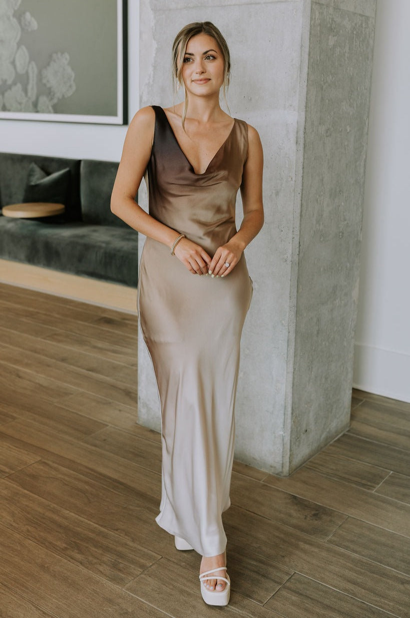 Full body view of female model wearing the Franceska Taupe Ombre Satin Midi Dress which features Brown Ombre Satin Fabric, Midi Length, Sleeveless, Black Thigh Length Lining and Cowl Neckline