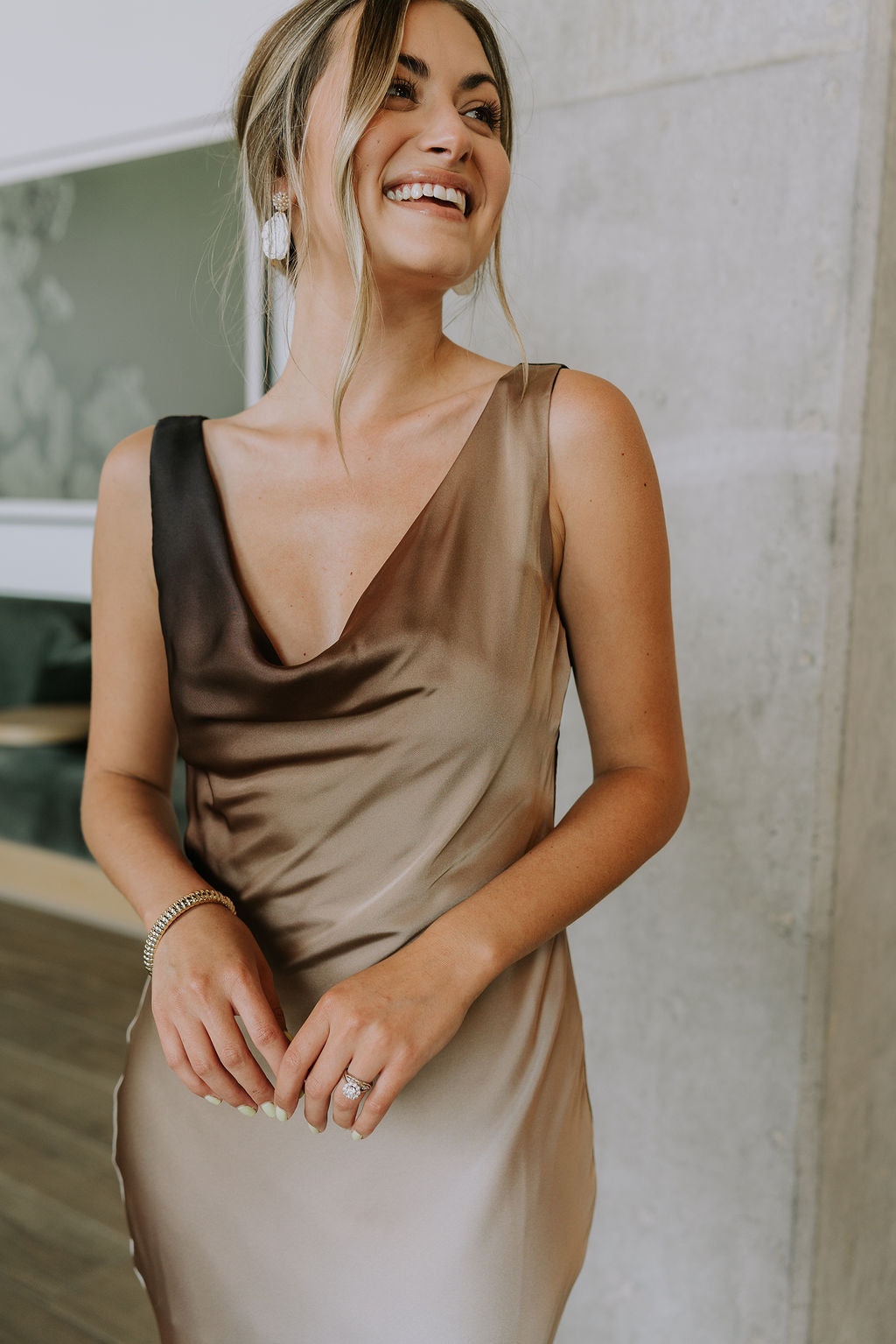 front view of female model wearing the Franceska Taupe Ombre Satin Midi Dress which features Brown Ombre Satin Fabric, Midi Length, Sleeveless, Black Thigh Length Lining and Cowl Neckline