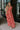 Full body view of female model wearing the Adalyn Pink & Red Paisley Cut-Out Maxi Dress which features Red, Pink and Peach Paisley Print,  Side Ruffle Slits, Peach Thigh Length Lining, Maxi Length, Elastic Waistband, Side Cutouts with Rattan Buckle, Plunge Neckline, Ruffle Straps  andTie Back Closure