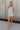Front full body view of Alyssa Floral Romper that is light blue and cream, with a V neckline, spaghetti straps, and mini length.