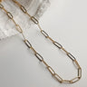 Image shows the Sadie Gold Textured Chain Link Necklace against a white background. Necklace has skinny oval gold textured chain links. Shown without charms.