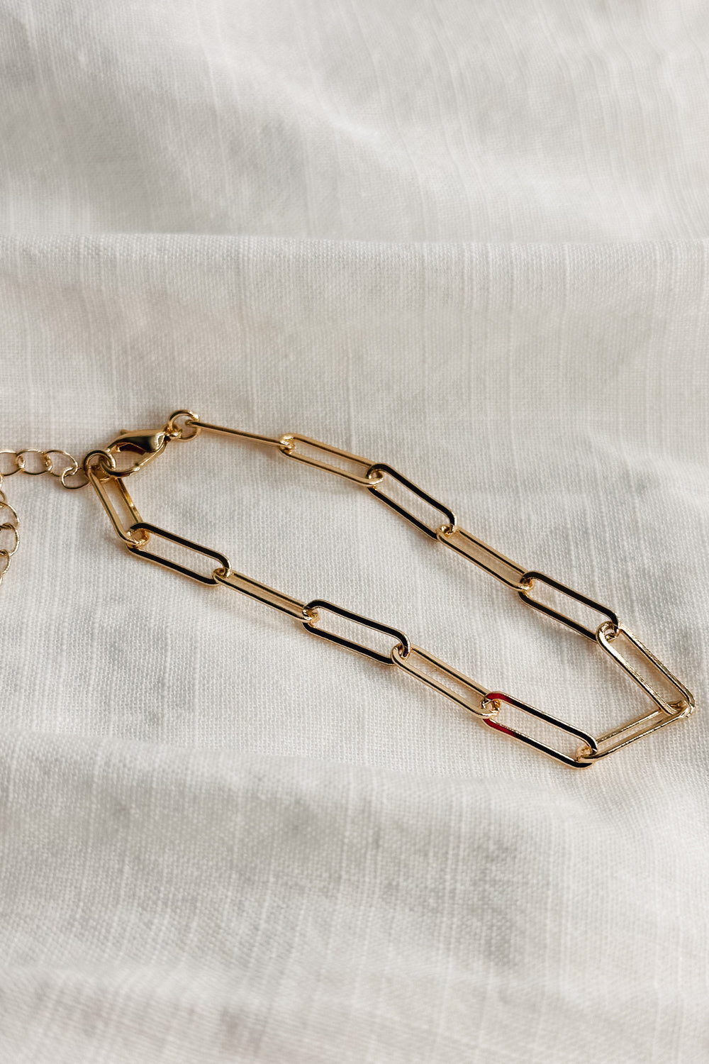 Image shows Leanne Gold Oval Chain Link Bracelet against a white background. Bracelet has gold oval links.
