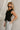 Lylah Black Cinched Tie Sleeveless Top- side view