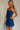 side view of female model wearing the Amaya Strapless Flare Mini Dress which features Lightweight Fabric, Side Zipper Closure, Belt Loops, Two Front Pockets, Strapless and Shorts Lining. the dress is available in red and navy blue