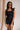 Model is pictured wearing the Tianna Romper in a size small.
