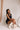 Model is pictured wearing the Tianna Romper in a size small.