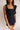 Model is pictured wearing the Tianna Romper in a size small.