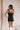 Model is pictured wearing the Tianna Romper in a size small.