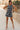 Front view of female model wearing the Mackenzie Black & White Romper